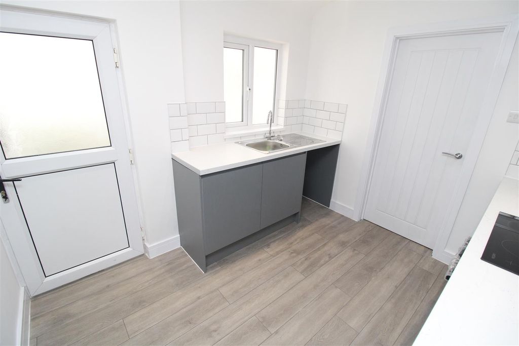 Property photo 2 of 11 Modern Bright Kitchen With Sleek Grey Cabinetry...