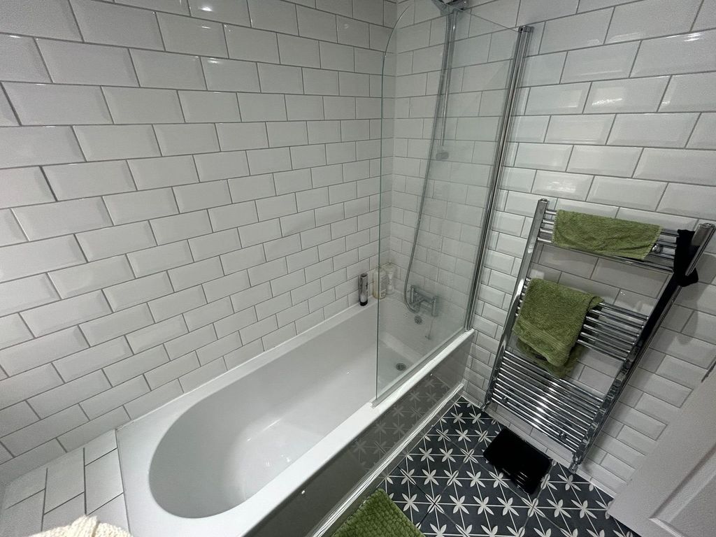 Property photo 1 of 15 Modern Bathroom Featuring A Clean White Tiled Bath...
