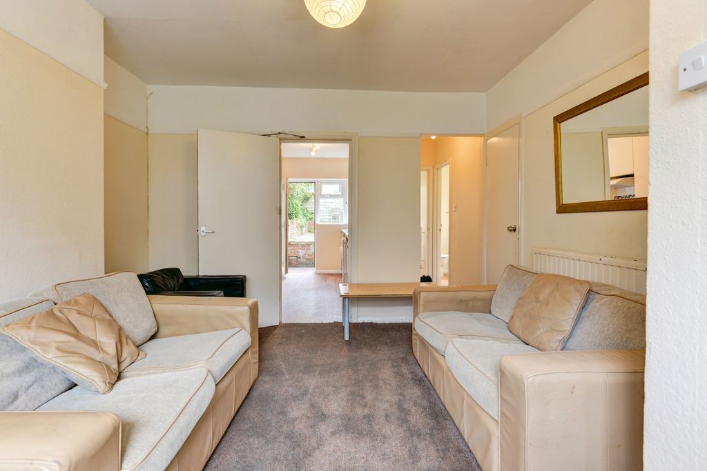 Property photo 1 of 17 A Bright And Inviting Living Room With Comfortable...