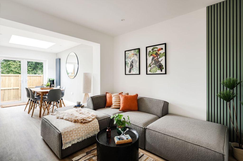 Property photo 3 of 19 A Spacious And Modern Living Room Filled With Natu...