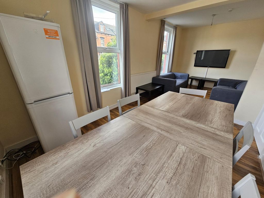 Property photo 2 of 20 A Bright And Inviting Living Room Featuring A Larg...