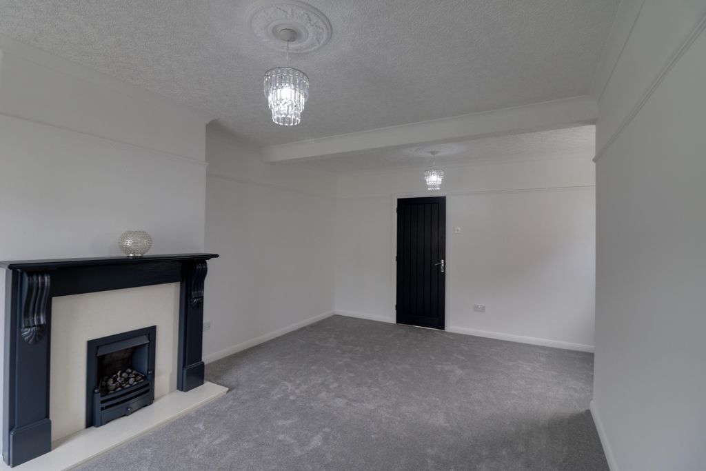 Property photo 3 of 12 Lounge And Dining Area With A Feature Fireplace