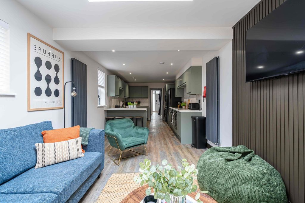 Property photo 2 of 38 Bright And Stylish Living Room Featuring A Comfort...