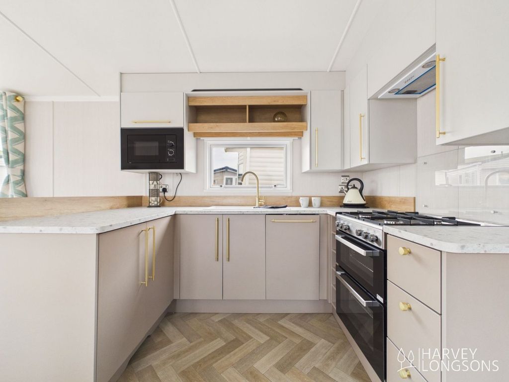 Property photo 2 of 12 Swift Burgundy Modern Fitted Kitchen At Lossiemouth Holiday Park