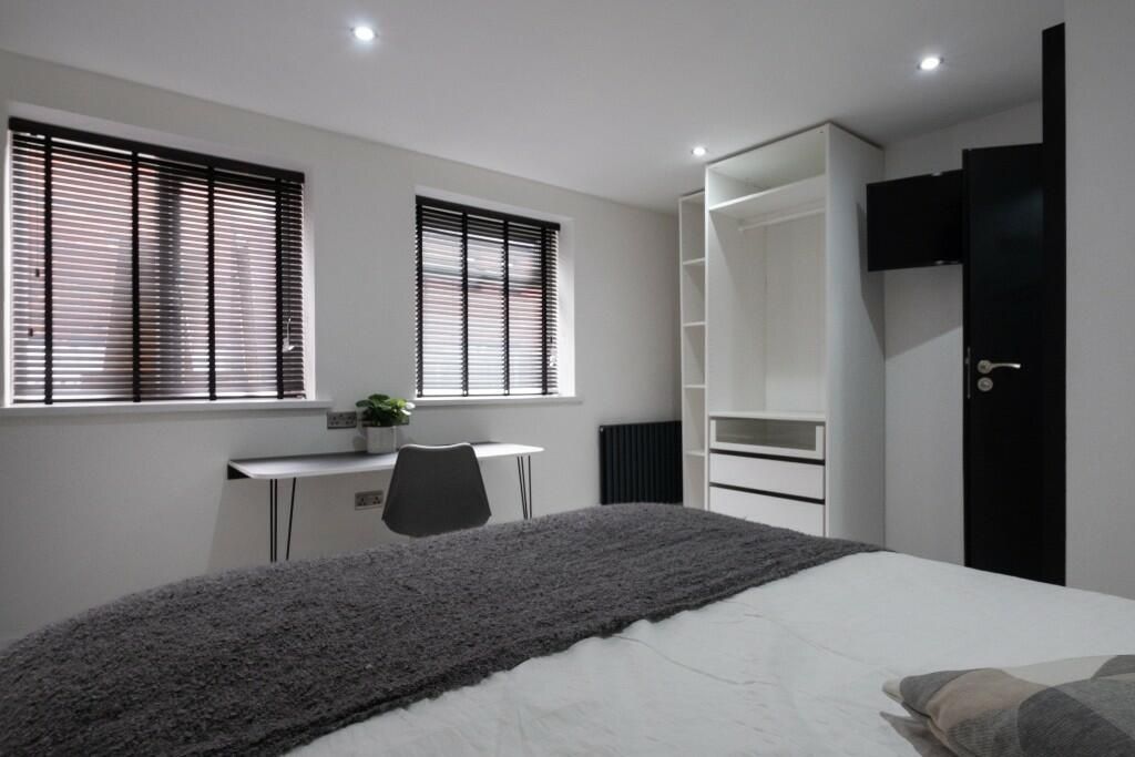 Property photo 2 of 15 A Bright And Modern Master Bedroom Featuring Ample...
