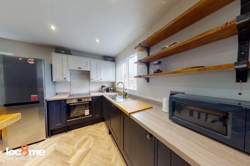 Property photo 3 of 7 A Modern And Tidy Kitchenette Featuring Ample Stor...