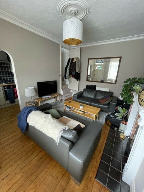 Property photo 2 of 11 A Bright And Welcoming Living Room Featuring Comfo...