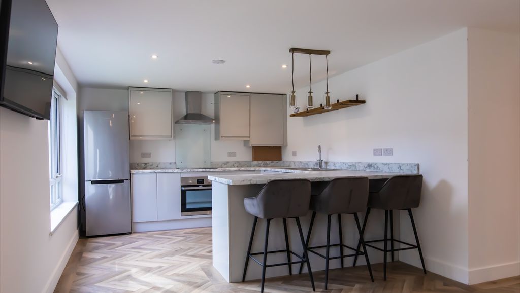 Property photo 1 of 7 Contemporary Open-Plan Kitchen With A Marble-Effec...