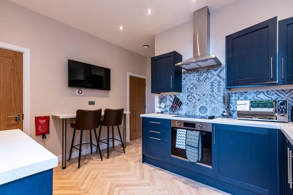 Property photo 1 of 7 Modern Kitchen Featuring Sleek Cabinetry, Stylish ...