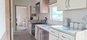 Property photo 3 of 6 Fully Equipped Kitchen With Fitted Units, Cooker And Worktop Space