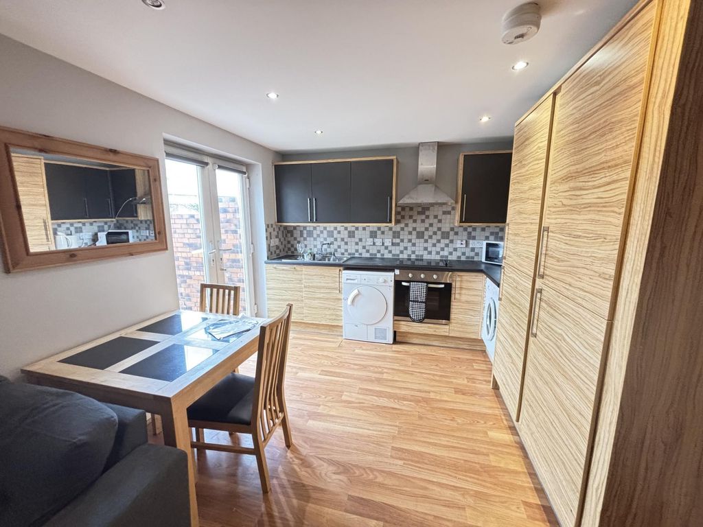 Property photo 1 of 9 A Bright And Modern Living Room Featuring Ample Na...