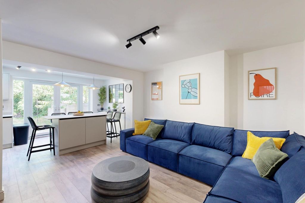 Property photo 1 of 21 Bright And Spacious Living Room Featuring A Large ...