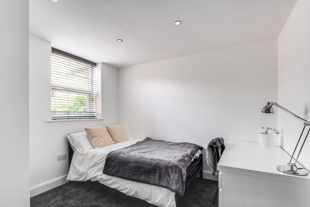 Property photo 3 of 5 Bright And Modern Master Bedroom Featuring A Comfo...