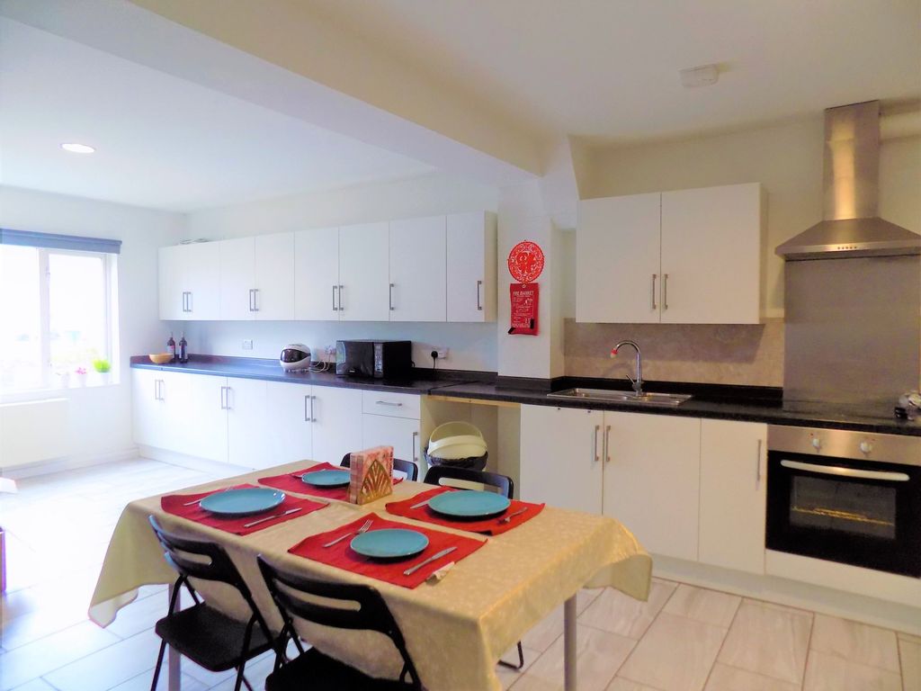 Property photo 2 of 32 Bright And Spacious Kitchen With Modern White Cabi...