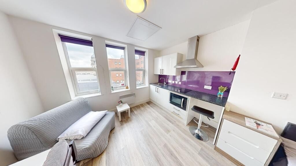 Property photo 3 of 5 Modern Kitchen Space Featuring Ample Natural Light...