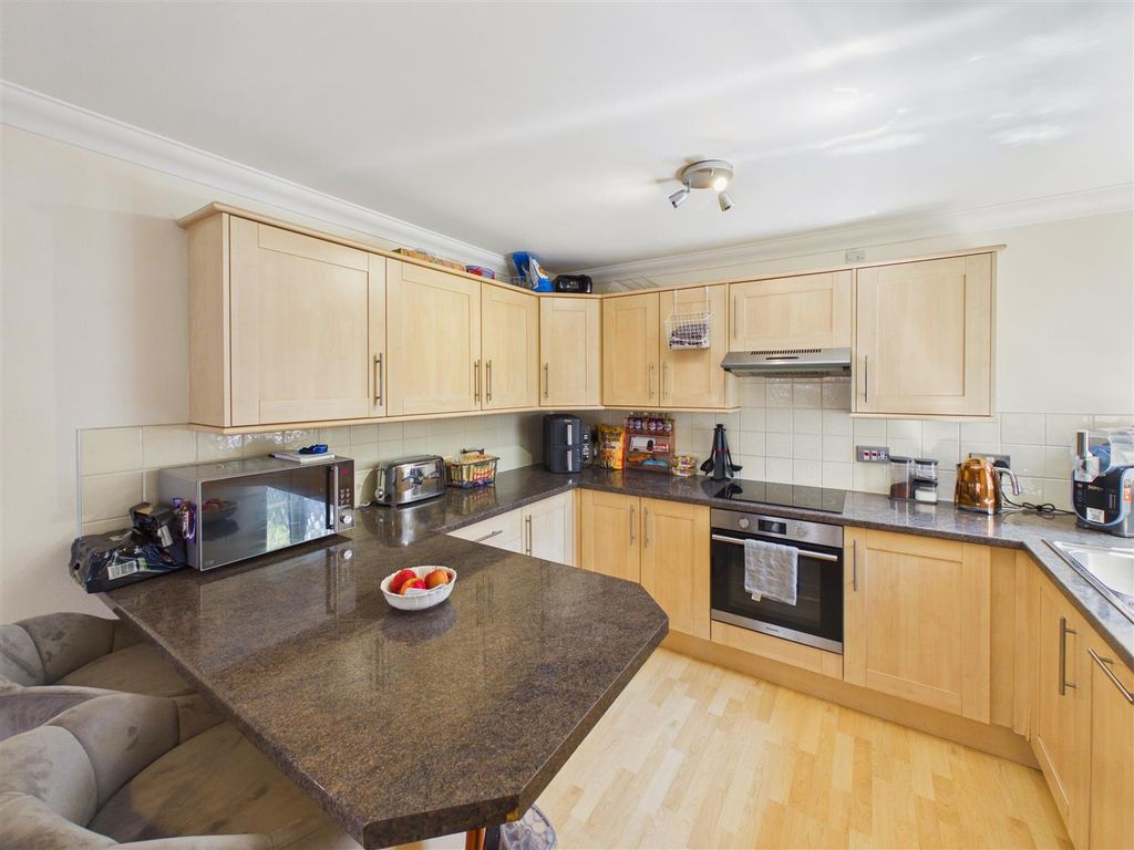 Property photo 3 of 9 Kitchen Area