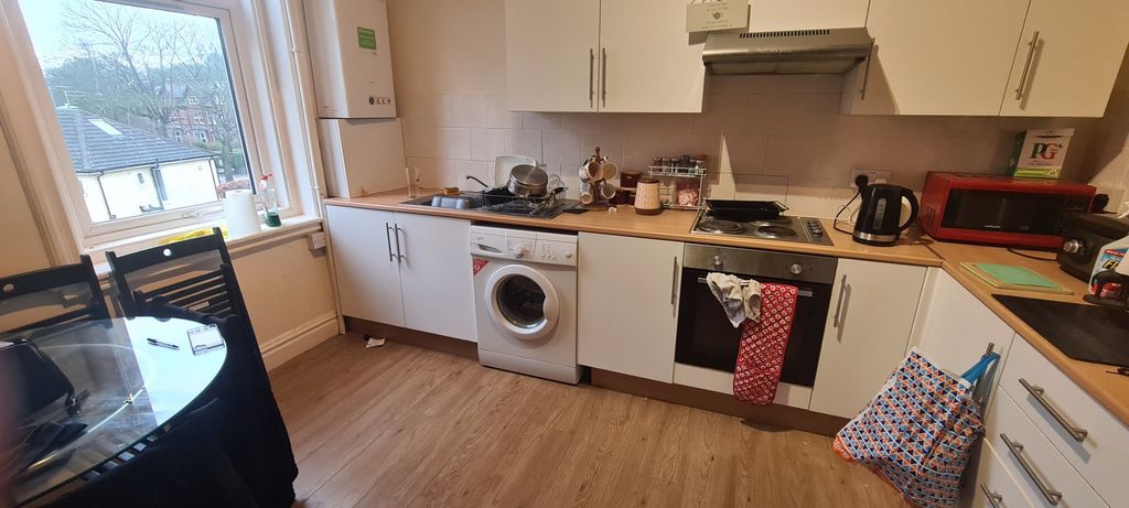 Property photo 2 of 5 Bright Galley-Style Kitchen With Plenty Of Counter...