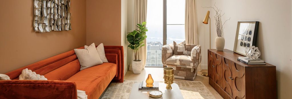 Property photo 1 of 4 Contemporary Designed Living Space With Wide Sofa And Cabinet Drawer, Coffee Table And Floor To