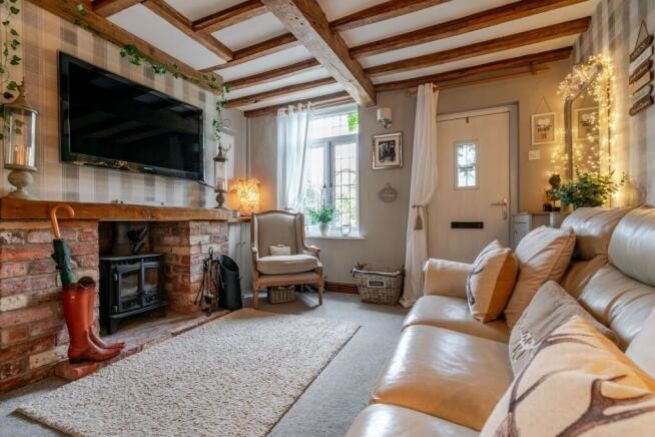 Property photo 3 of 19 Living Room - Wisteria Cottage Marsh Lane Charlott