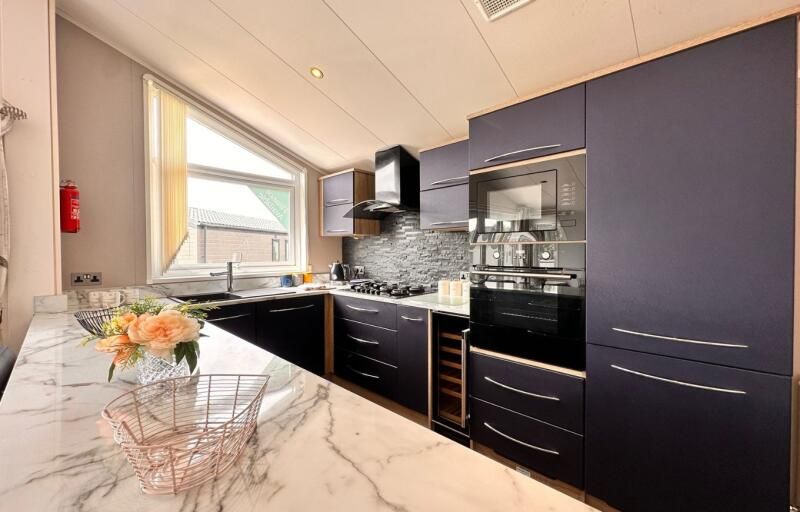 Property photo 3 of 8 Atlas Laburnum Lodge Kitchen Area At Hoburne Cotswold Reach Holiday Park
