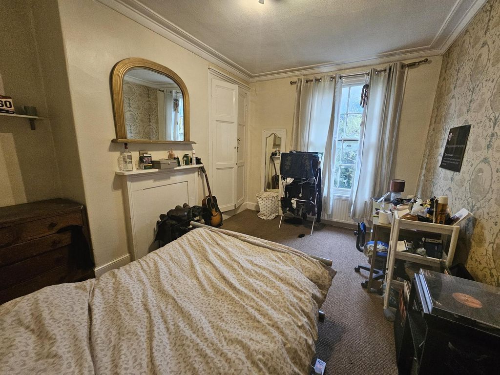 Property photo 3 of 19 A Cozy Bedroom Featuring A Comfortable Double Bed,...