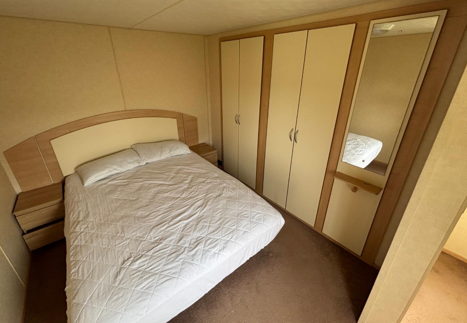 Property photo 3 of 4 Abi Vista Double Bedroom Featuring Fitted Wardrobes, Bedside Cabinets And A Mirror