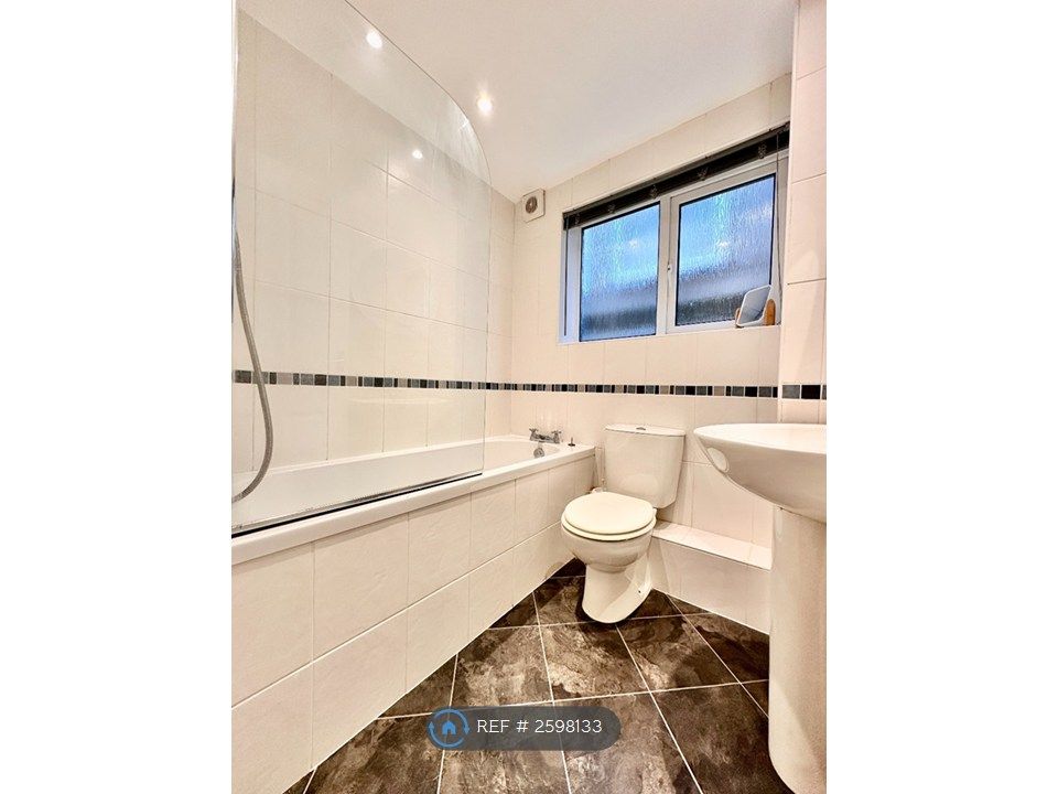 Property photo 3 of 8 Modern Bathroom With Over Bath Shower