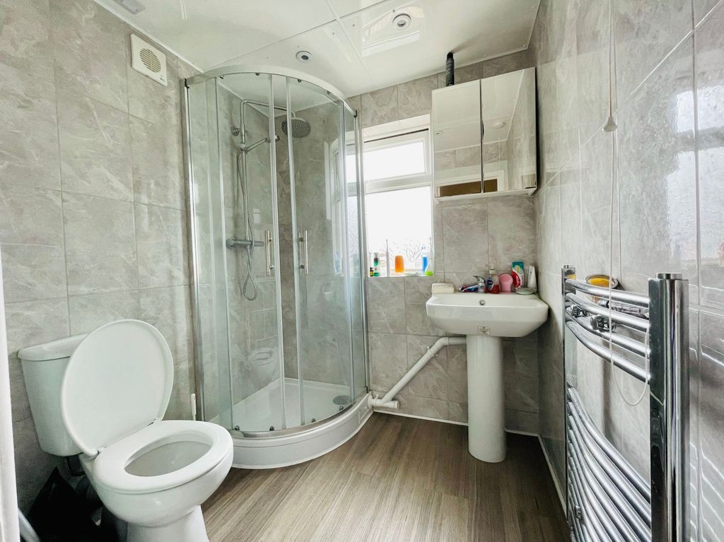 Property photo 3 of 6 Bright And Clean Bathroom Featuring A Shower Enclo...