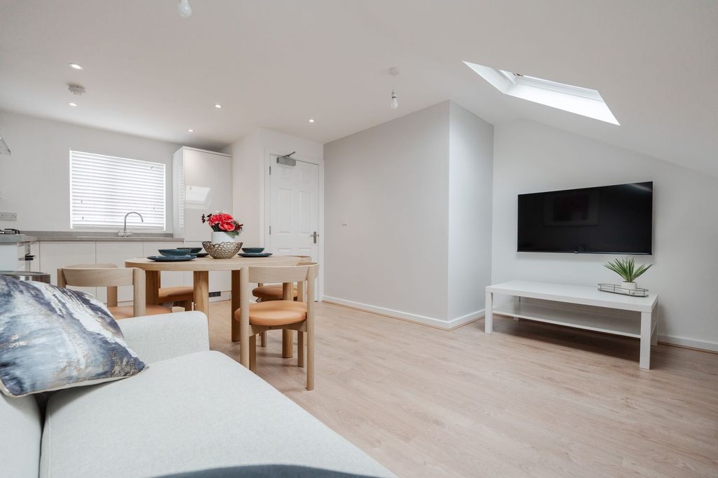 Property photo 2 of 9 Bright And Modern Living Room With Ample Natural l...