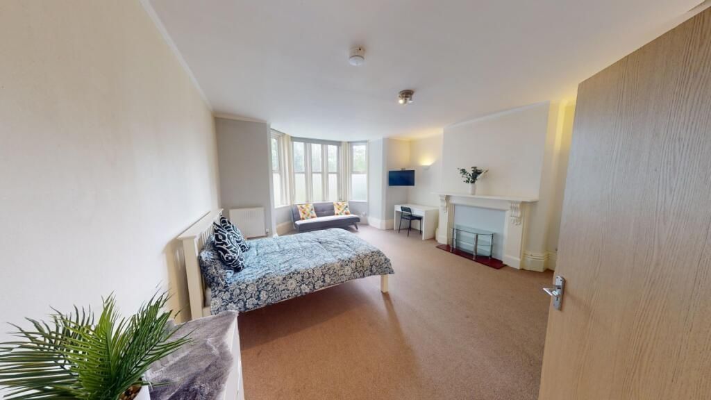 Property photo 3 of 9 Bright And Spacious Master Bedroom Featuring A Dou...