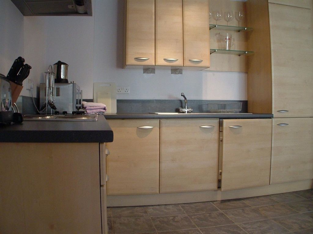 Property photo 3 of 5 Modern Kitchen With Sleek Wooden Cabinetry...