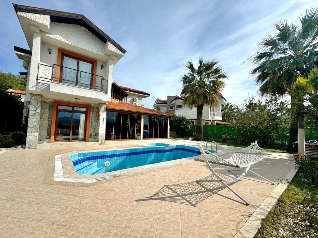 Property photo 2 of 26 A Detached Villa For Sale In Seydikemer, Fethiye - Main View Of The Private Villa With A Large Sunbathing Terrace And Private Swimming Pool