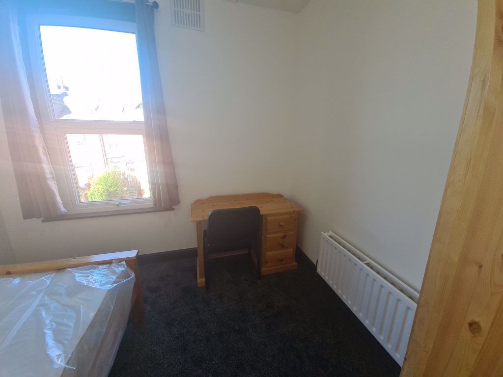 Property photo 1 of 13 A Cozy Bedroom Featuring A Window That Allows Natu...