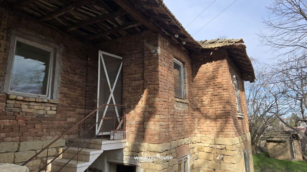 Property photo 2 of 53 Side Perspective Of The Brick House Featuring White-Framed Windows And A Metal Staircase Leading To An Upper Door
