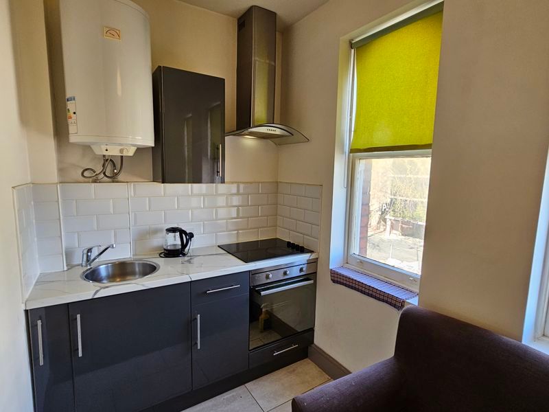 Property photo 2 of 7 Kitchen Area