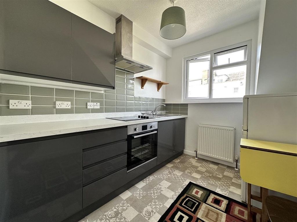 Property photo 2 of 5 Modern Kitchen With Sleek Cabinetry And Natural li...