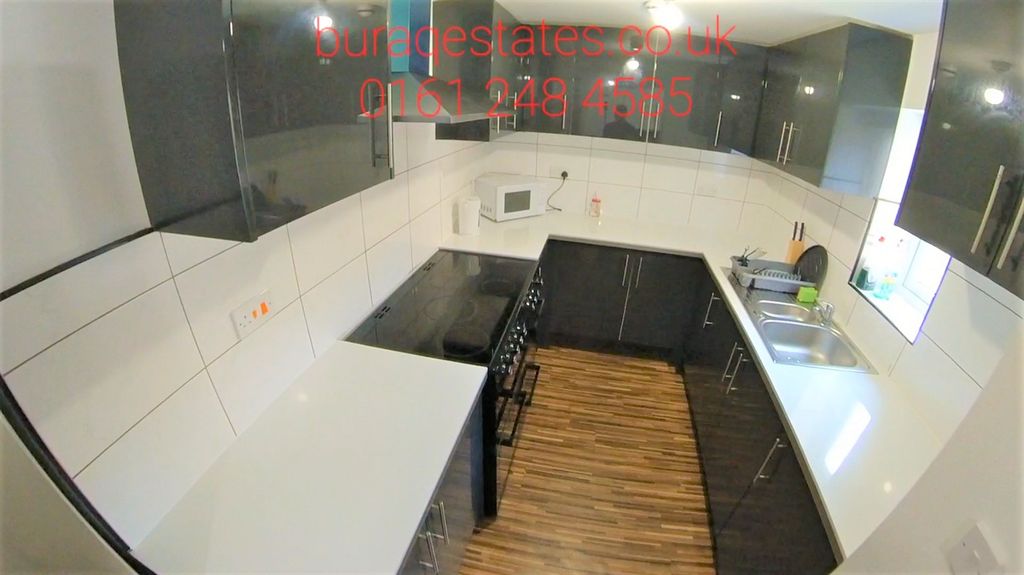 Property photo 1 of 13 Modern Galley Kitchen With Sleek White Worktops, i...