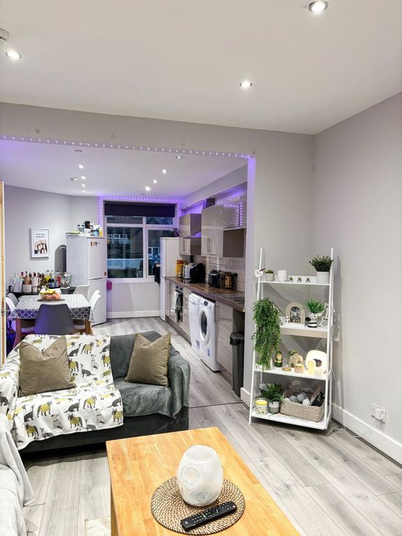 Property photo 3 of 20 Bright Open-Plan Living Area With Modern Wood-Effe...