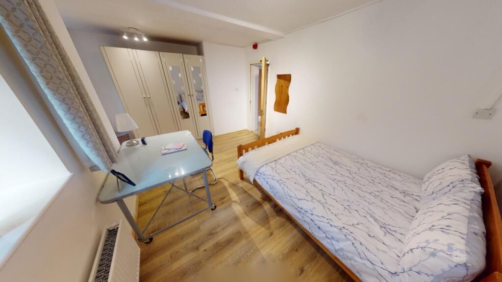 Property photo 2 of 10 A Neat And Cozy Single Bedroom Featuring A Comfort...
