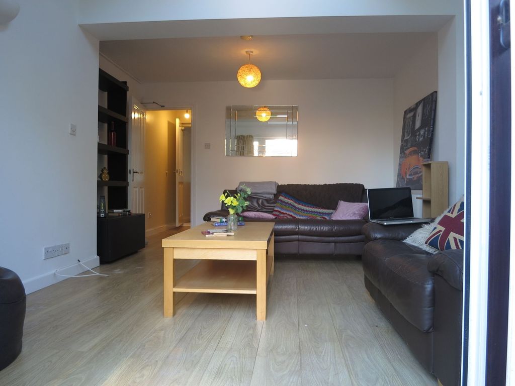 Property photo 2 of 15 A Spacious, Well-Lit Living Room Featuring Two Com...