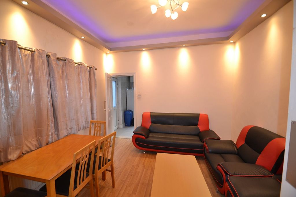 Property photo 2 of 30 Bright And Inviting Living Room With Modern Black ...