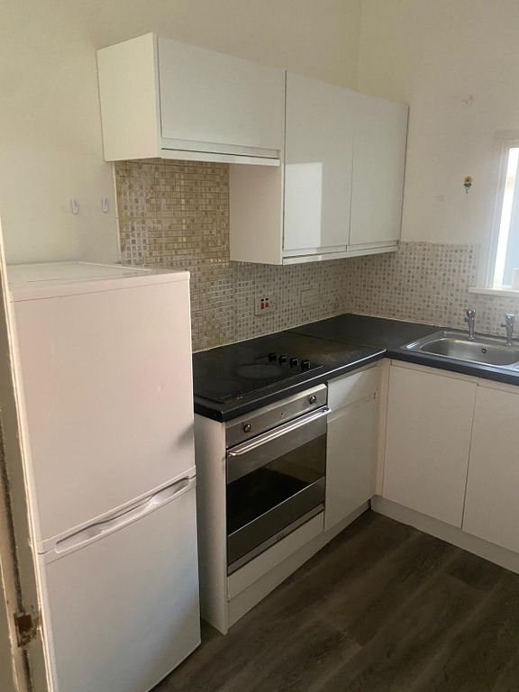 Property photo 1 of 6 A Compact And Functional Kitchen Featuring Modern ...