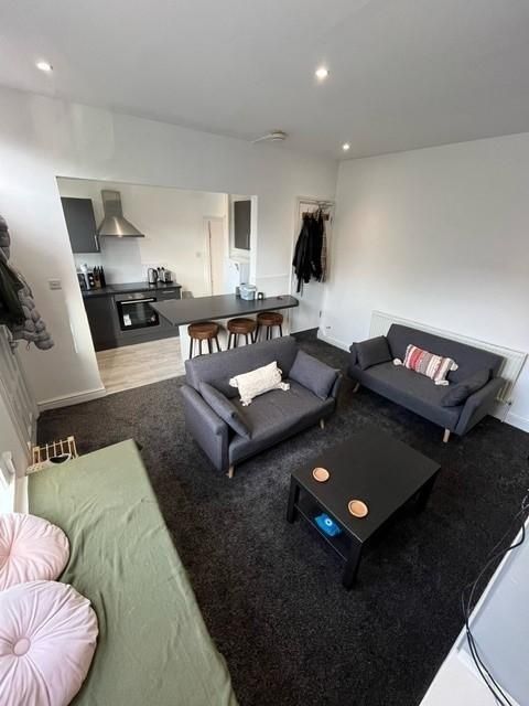 Property photo 3 of 38 A Modern And Welcoming Living Room Featuring Two c...