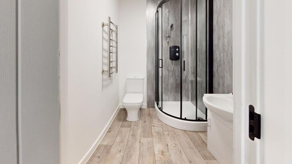 Property photo 3 of 15 A Modern And Clean Bathroom Featuring A Stylish Sh...