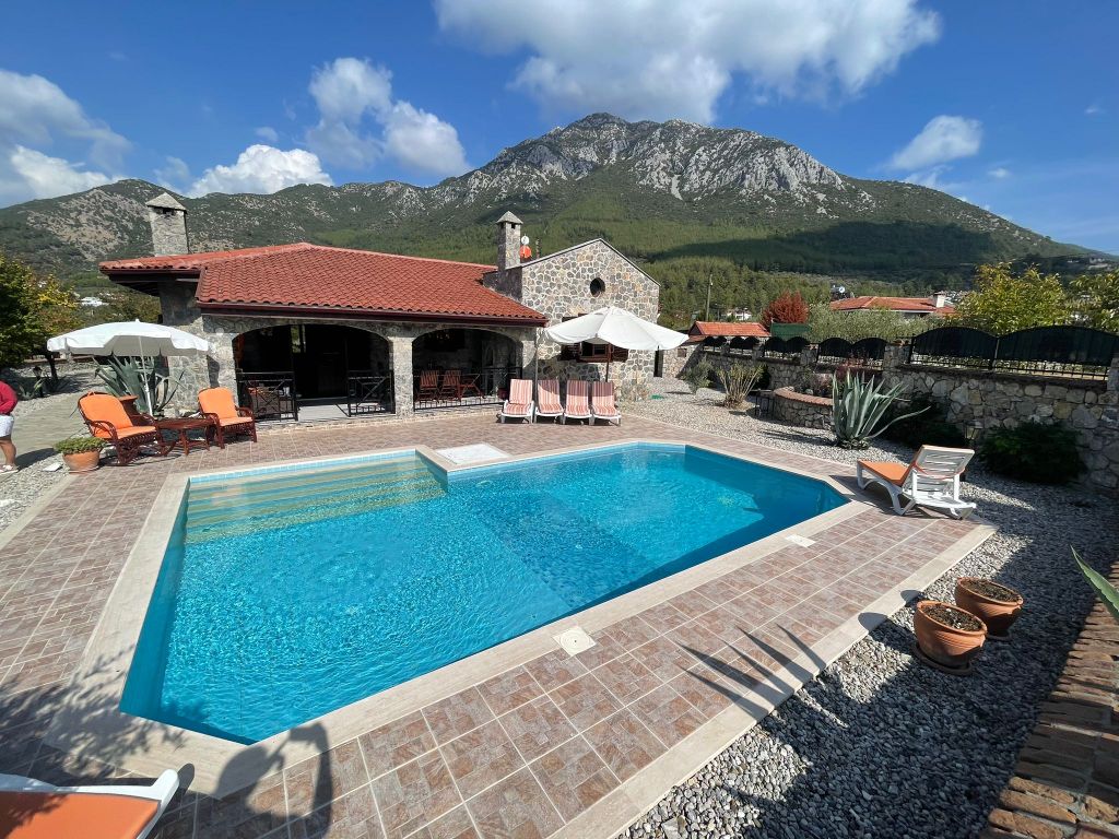 Property photo 1 of 22 Ready-To-Move Uzumlu Stone Bungalow For Sale - Main View Of The Bungalow And Beautiful Surroundings