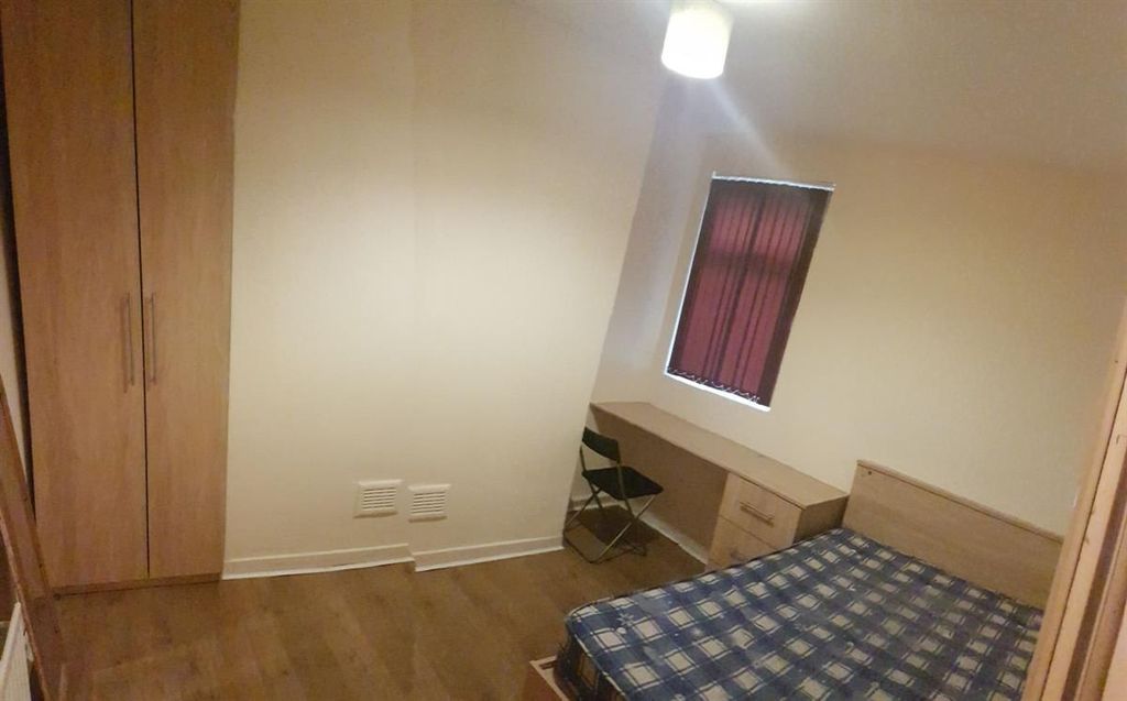 Property photo 2 of 15 Neat Furnished Bedroom With Wooden Flooring, Built...