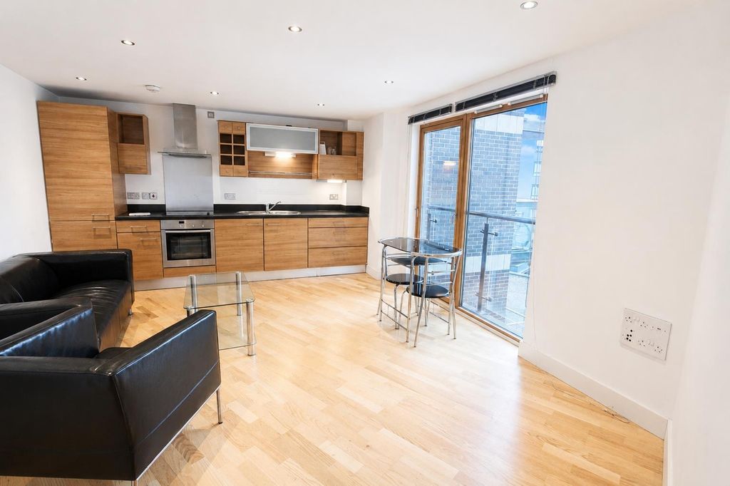 Property photo 1 of 9 Sleek Open-Plan Lounge With Balcony And Kitchen...