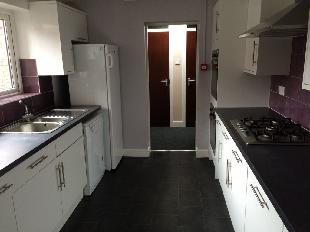 Property photo 3 of 13 A Modern And Tidy Kitchen With Ample Storage And N...