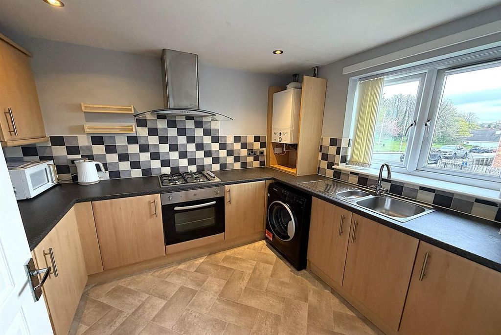 Property photo 2 of 11 Modern Kitchen With Ample Workspace And Storage...