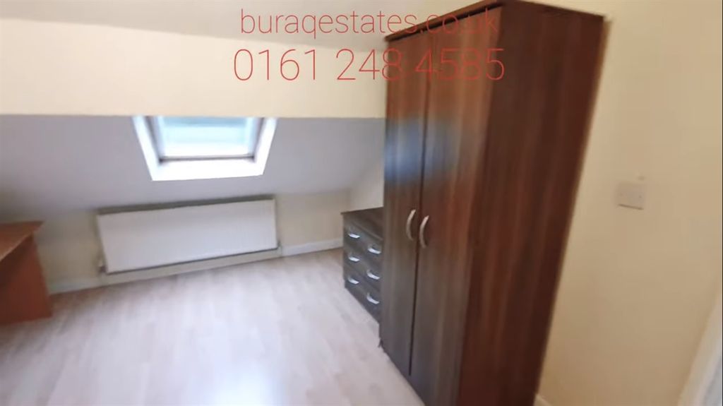 Property photo 3 of 11 A Bright And Tidy Bedroom Featuring A Wardrobe, Wi...